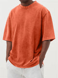 Men's loose fit stone washed polyester t-shirt in army green colour, showing distressed texture and short sleeves.