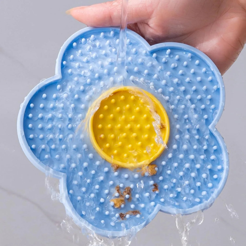 Flower-shaped silicone pet lick mat with suction cups in blue, grey, pink, purple, or red