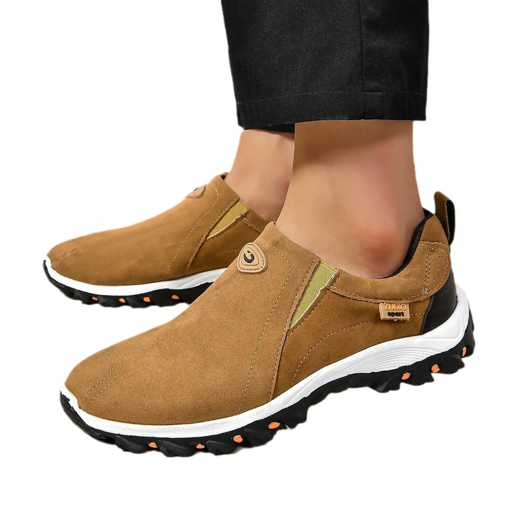 Men's gray round toe slip-on casual shoes with a rubber sole on a plain background.