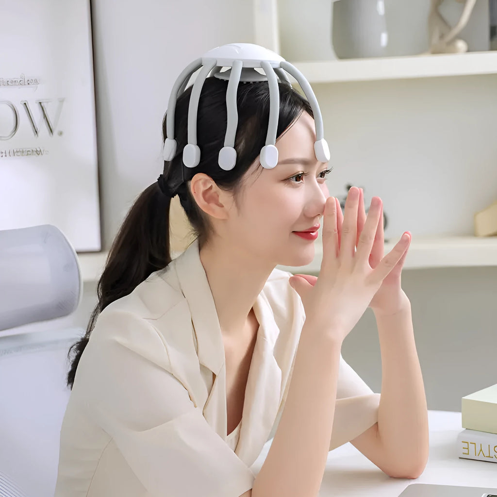 Black handheld USB head massager with multiple vibrating claws for scalp relaxation.