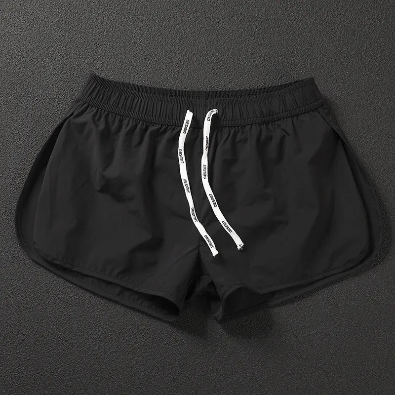 Men's loose polyester beach shorts in black, fluorescent green and orange red colours