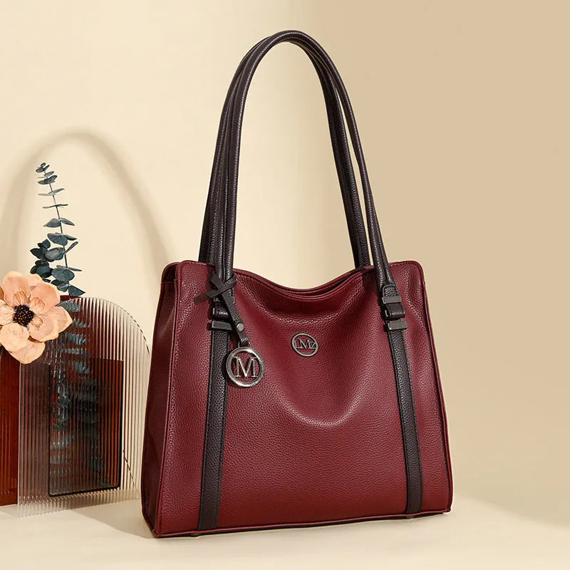Genuine leather women's crossbody bag in retro style showing horizontal square shape and double shoulder straps.