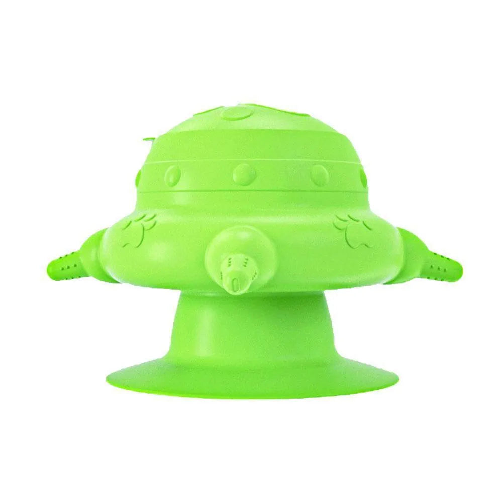 Pink silicone pet milk feeder with four nursing nipples for puppies and kittens on a flat base.