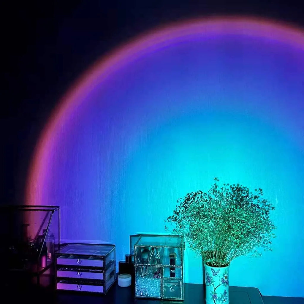 Rechargeable sunset lamp projecting rainbow colours with USB cable and push-button control