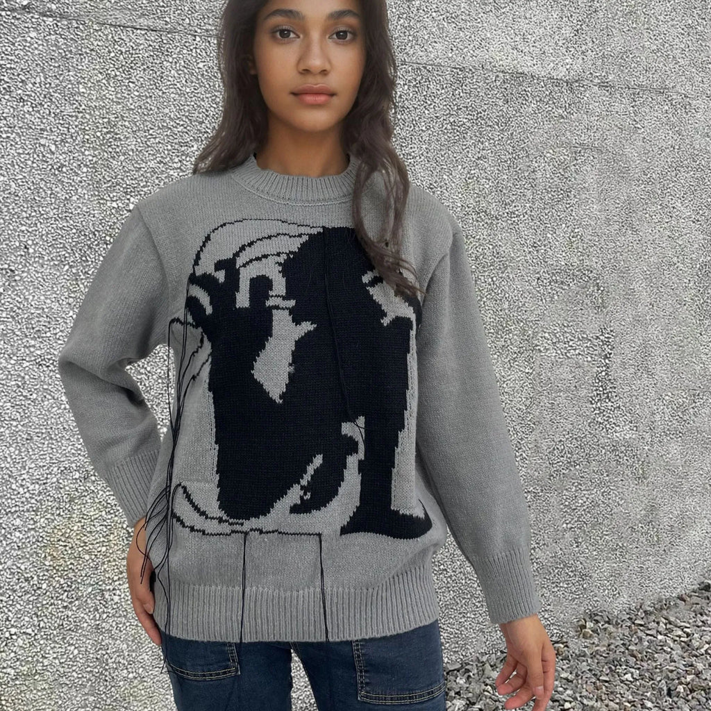 Women's grey alpaca wool pullover sweater with tassel detailing and abstract pattern