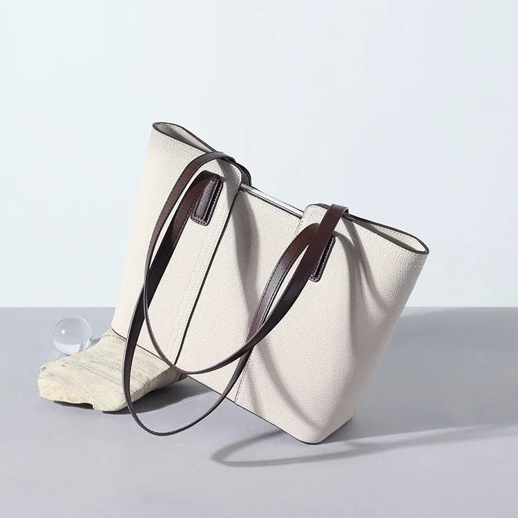 Women's genuine leather shoulder bag in box-type shape, shown in a choice of colours including khaki and black.