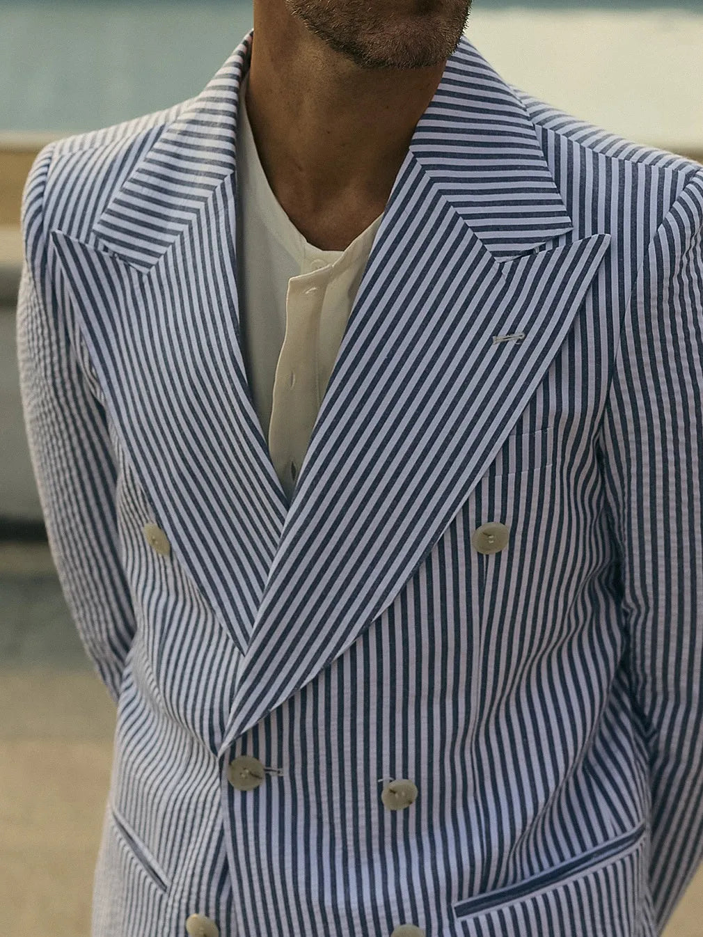 Blue and white striped polyester suit set with blazer and trousers