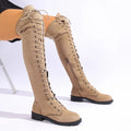Black lace-up over-the-knee boots with round toe, flat rubber sole, and decorative stitching on the shaft.