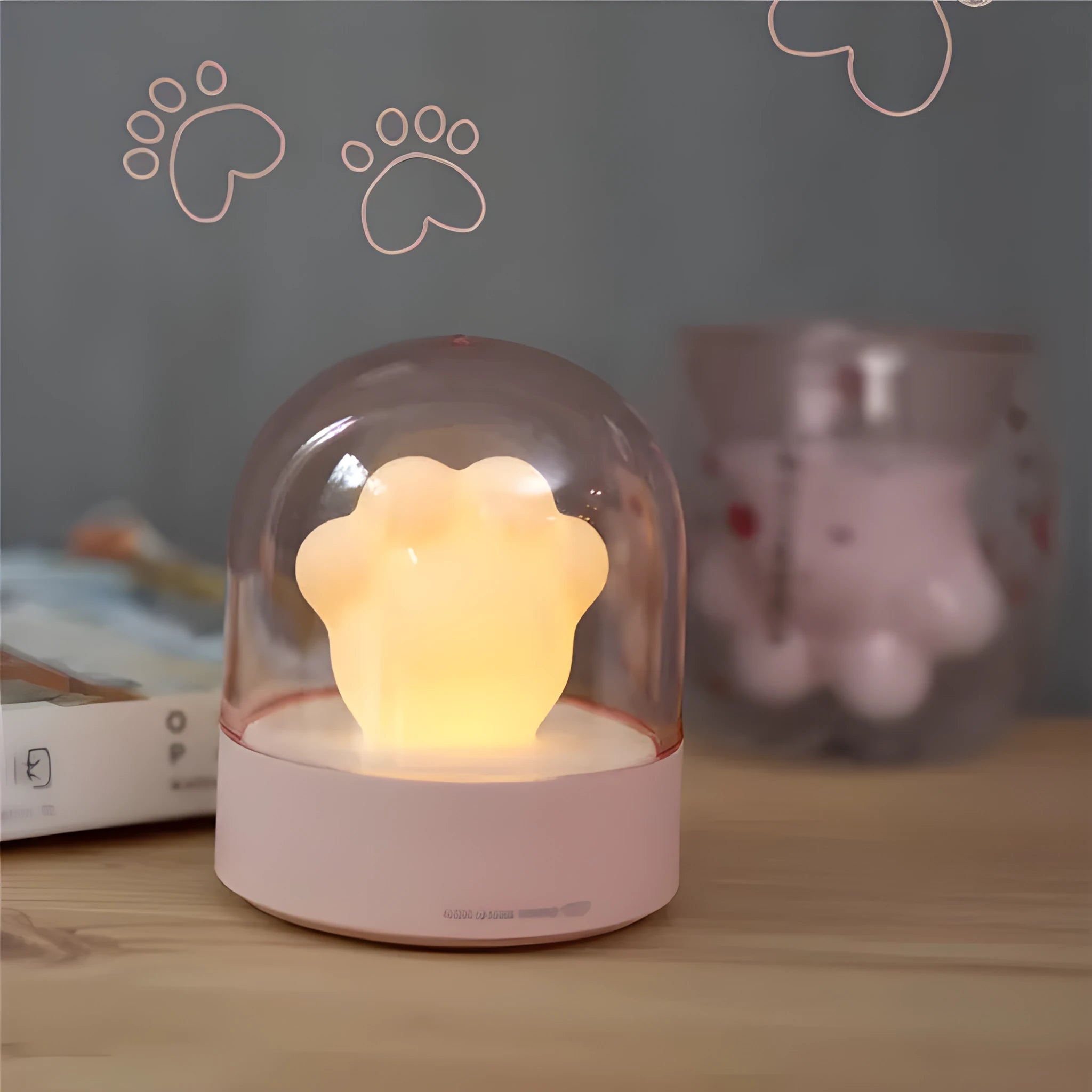 Grey or pink cat paw shaped night light with USB charging port and music box functionality