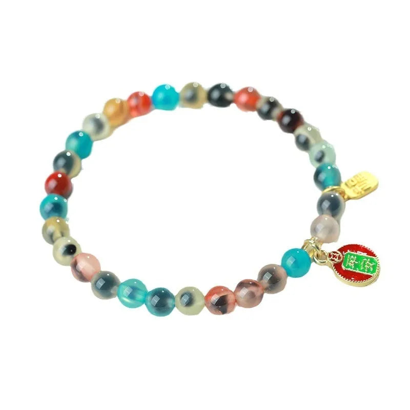 Women's agate bracelet with natural colourful sugar heart design and copper coin snake detailing