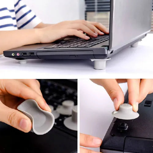 Set of four grey plastic laptop cooling pads, two large and two small, on a flat surface.