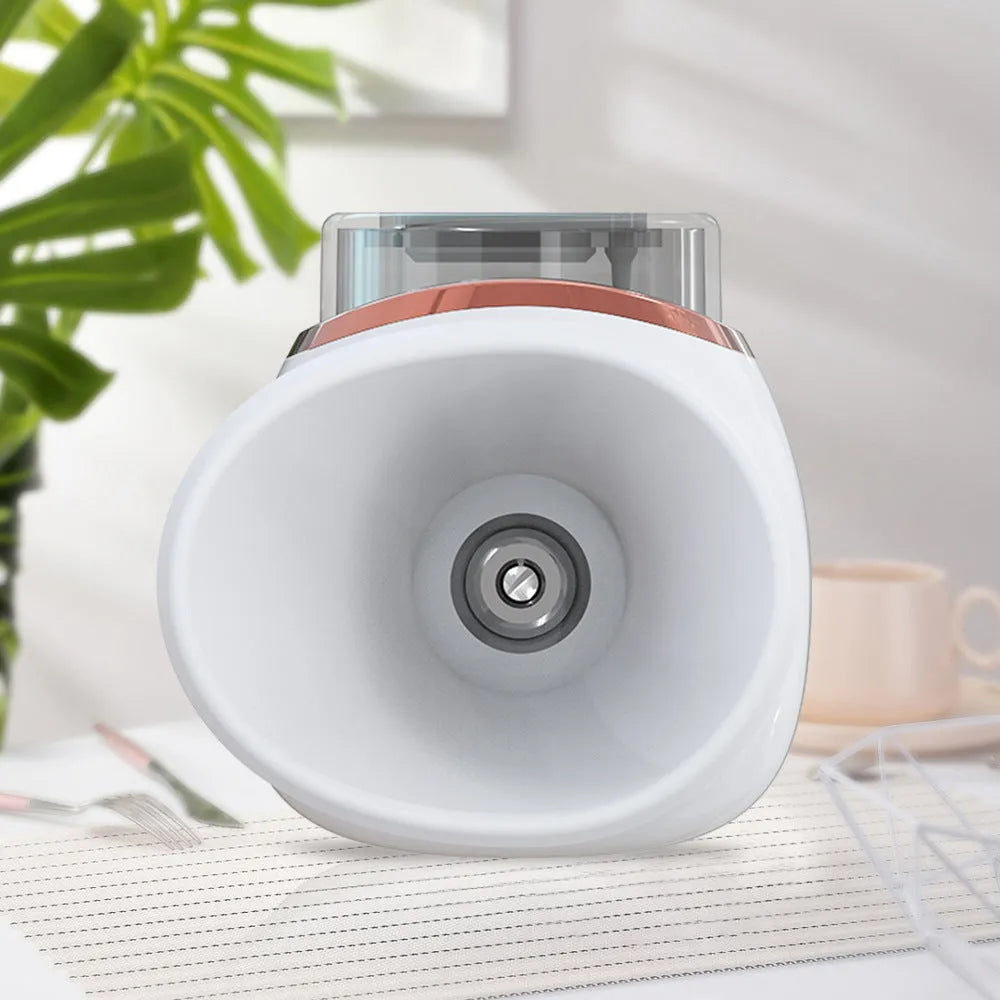 White and purple portable eye humidifier device with USB charging cable on a table.