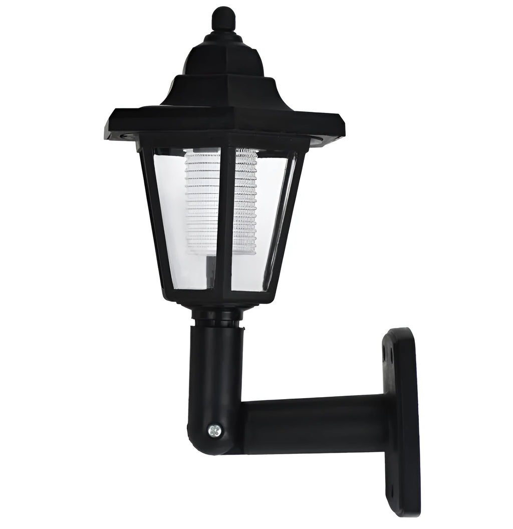 Black hexagonal solar wall lamp with integrated solar panel for outdoor garden or patio lighting