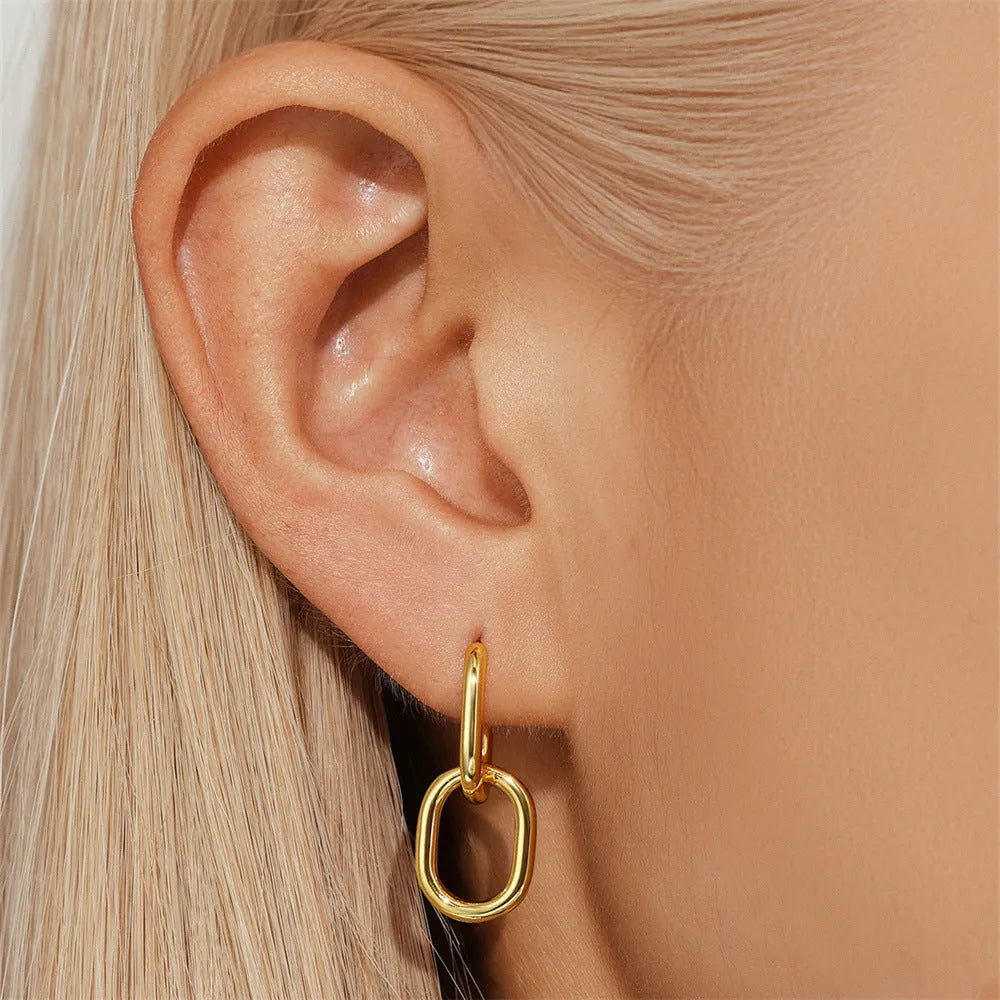 Brass diamond geometric earclip earrings with round elements and golden electroplated finish