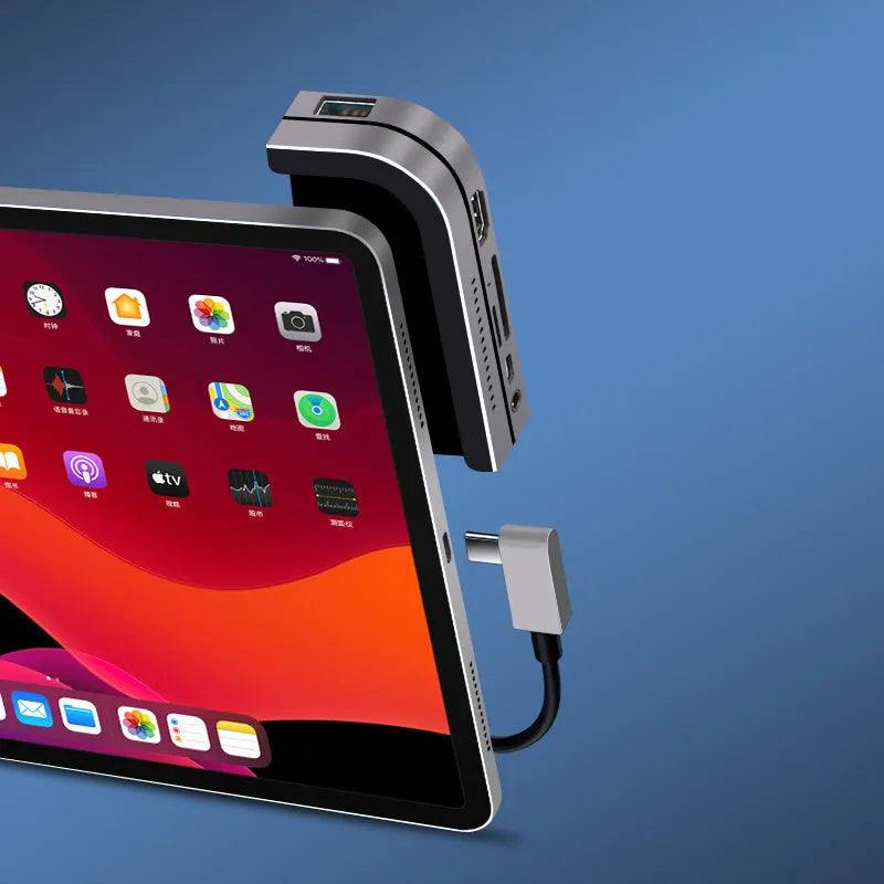 Silver aluminium grey USB-C docking station and multi-port converter for iPad Pro models.