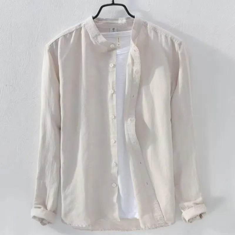 Loose fit long sleeve linen shirt in solid colour on hanger showing casual collar and button front