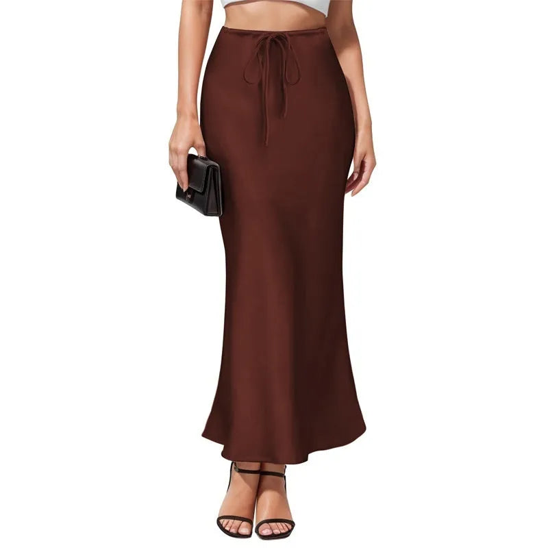 Acetate fabric asymmetric skirt with high waist and irregular stitching in solid colour