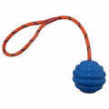 Rubber dog chew ball with knotted rope centre in multiple colours