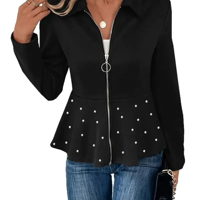 Women's black loose fit coat with beaded heavy-duty zipper and ruffled hem detail.