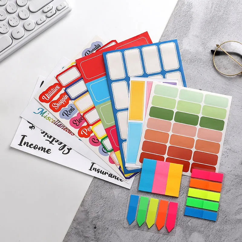 Handwritten label stickers showing multiple grid formats, A6 ruler versions, and coloured sticky notes on white background