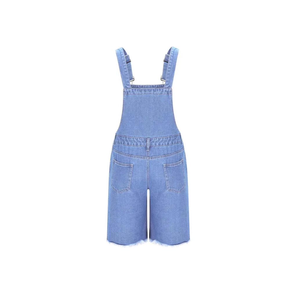 Men's ripped blue denim shorts with attached suspenders on a mid waist straight-leg fit.