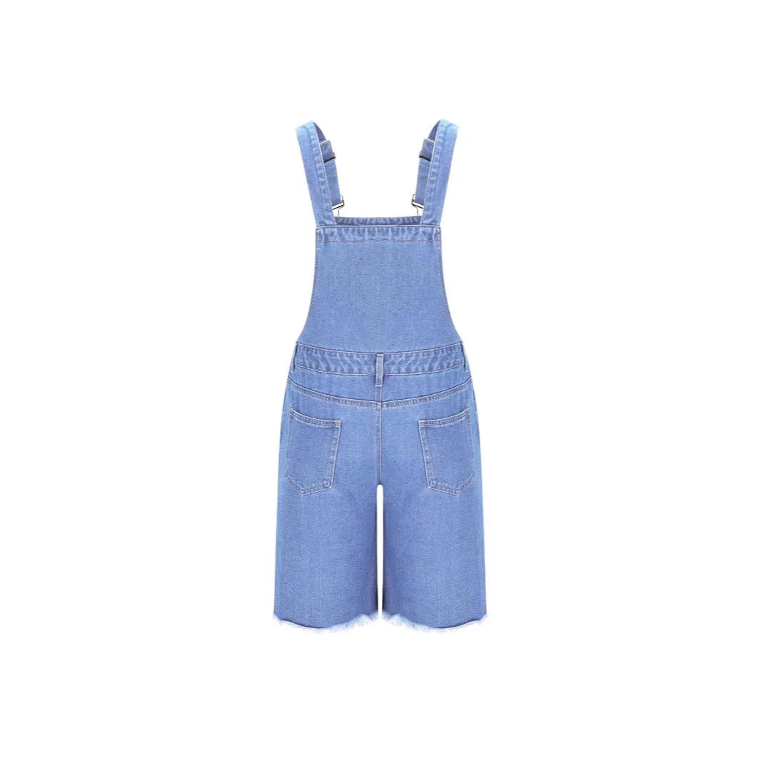 Men's ripped blue denim shorts with attached suspenders on a mid waist straight-leg fit.