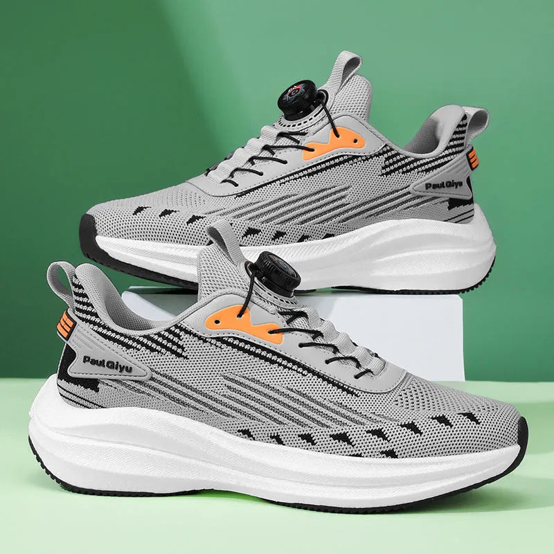 Men's white green and gray running shoes with rotating buckle and mesh upper on flat TPU sole.