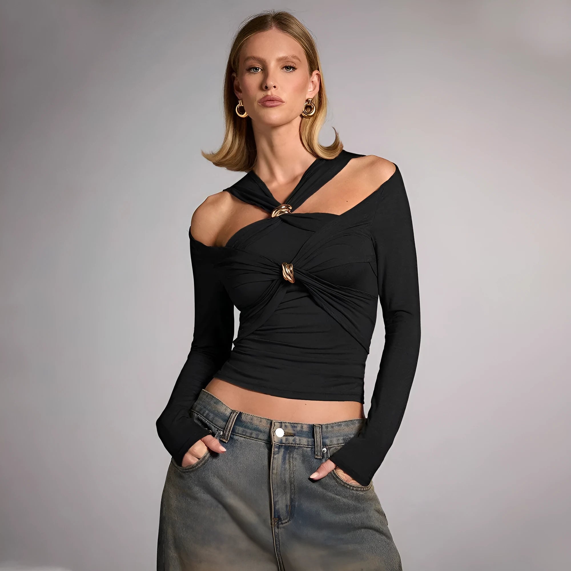 Black women's slim fit halter neck cropped top on a model, showing the sleeveless shoulder-baring design.