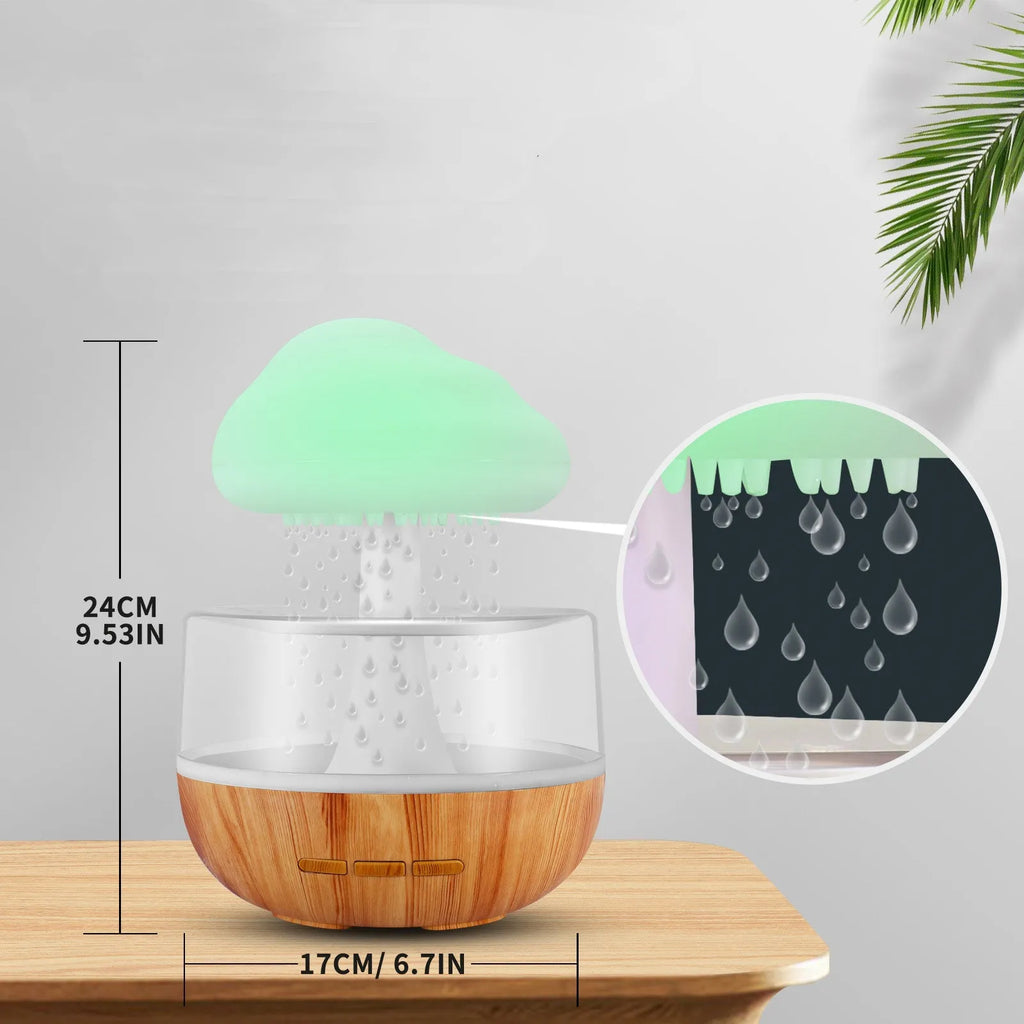 White raining cloud humidifier with essential oil diffuser and multi-colour night light on table