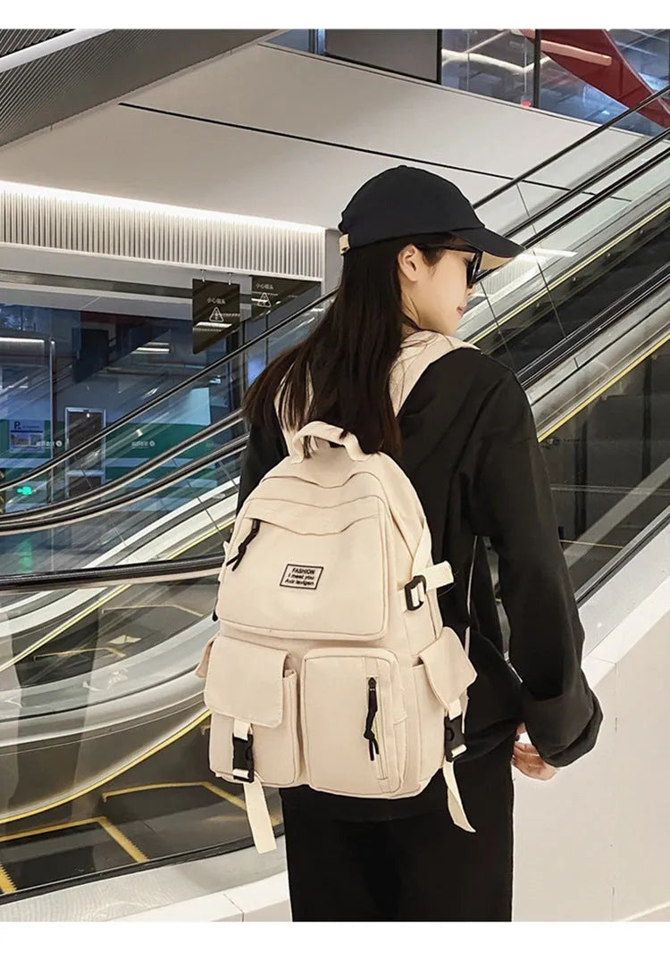 Black student backpack with three-dimensional pockets showing computer compartment