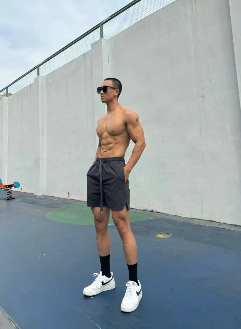 Men's ice silk quick-drying double-layer casual shorts in multiple colours on a size chart
