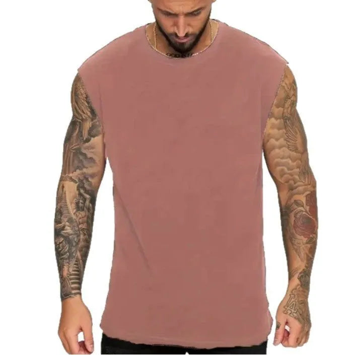 Men's loose fit cotton sleeveless t-shirt in a solid colour, shown on a hanger.