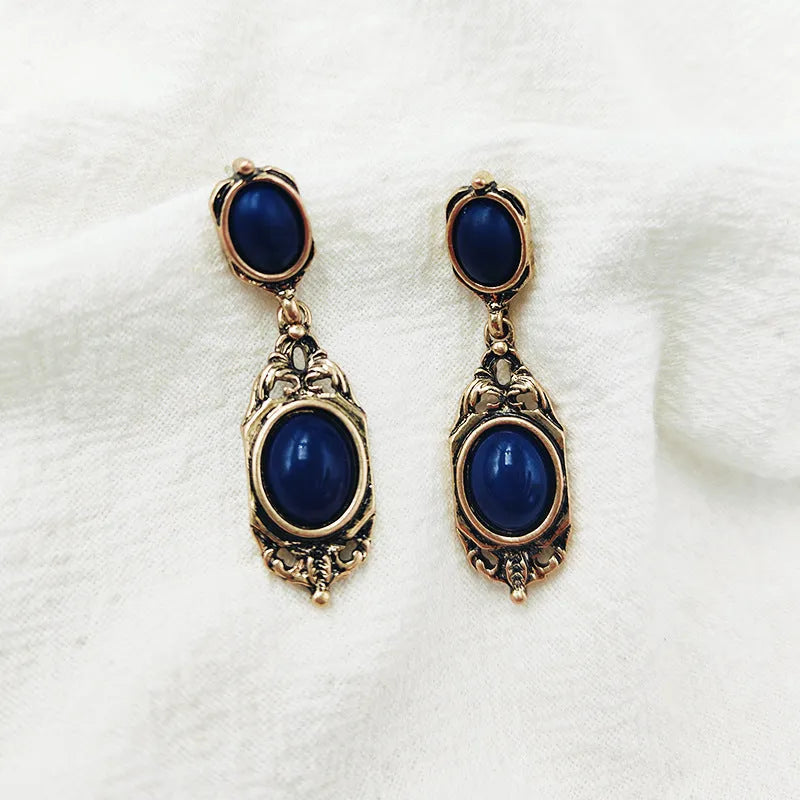 Retro Chinese style alloy earring pair with electroplated silver finish showing silver needle and triangle ear clip options