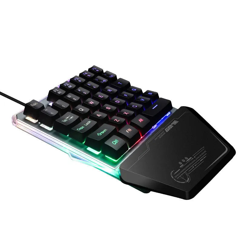 G40 black one-handed mechanical keyboard with RGB backlit keys on a desk.