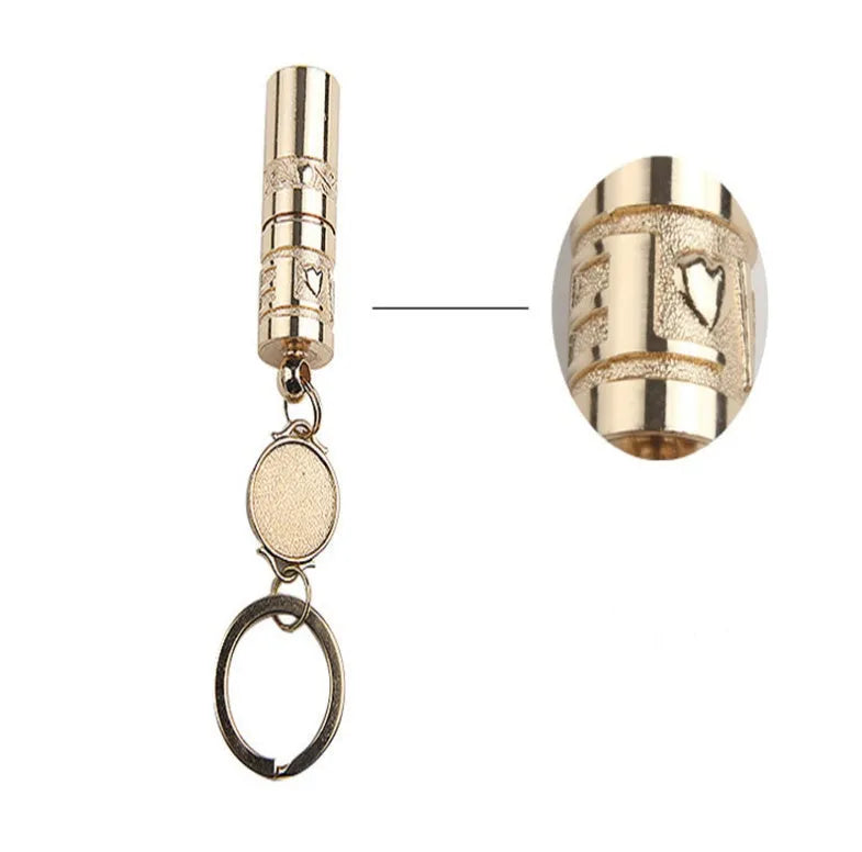 Gold zinc alloy waterproof mini LED flashlight on a keychain.