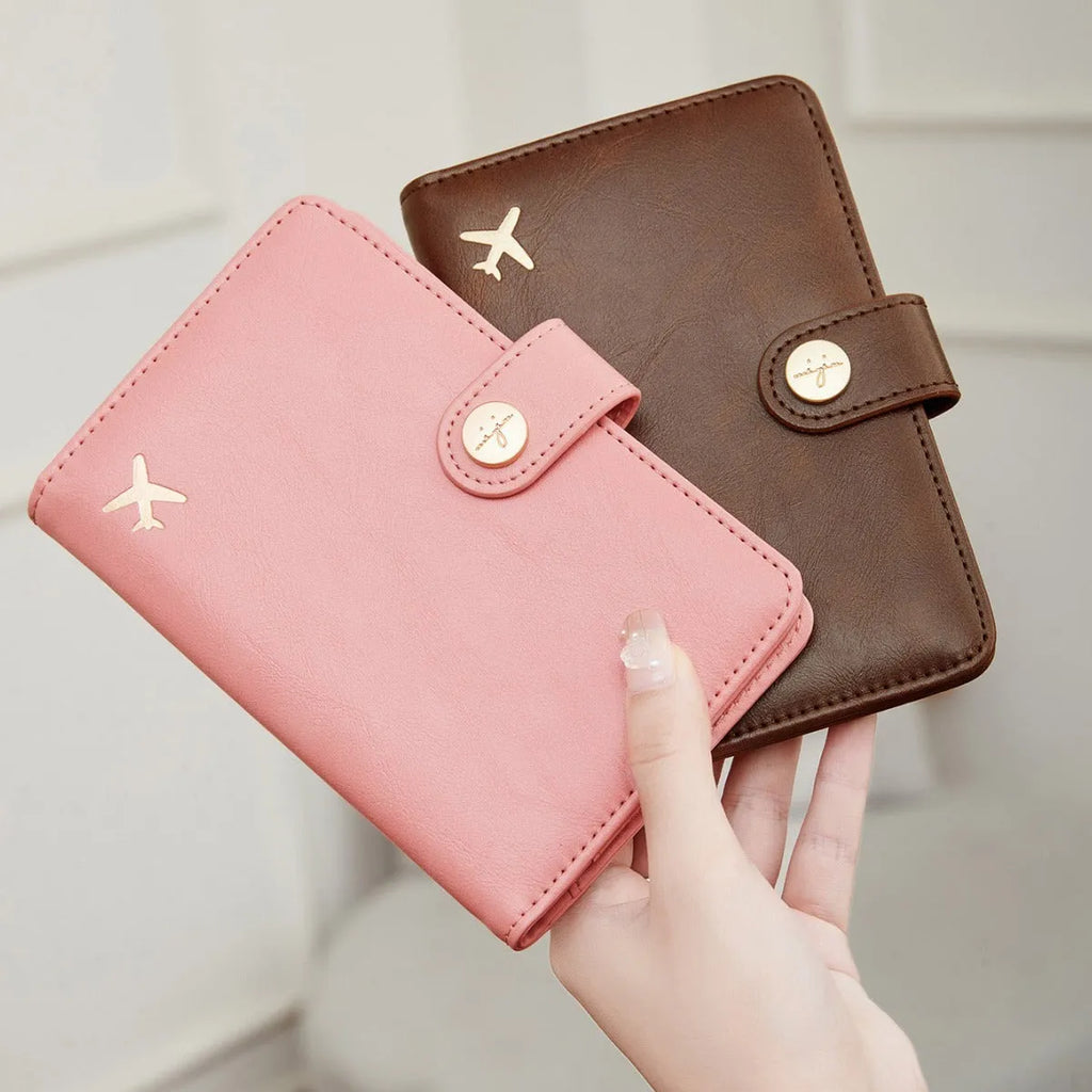 PU leather passport holder with RFID protection in multiple colour options including pink, black, and blue