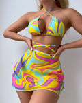 Yellow striped halter swimsuit for women with lace-up front, matching skirt, and shorts.
