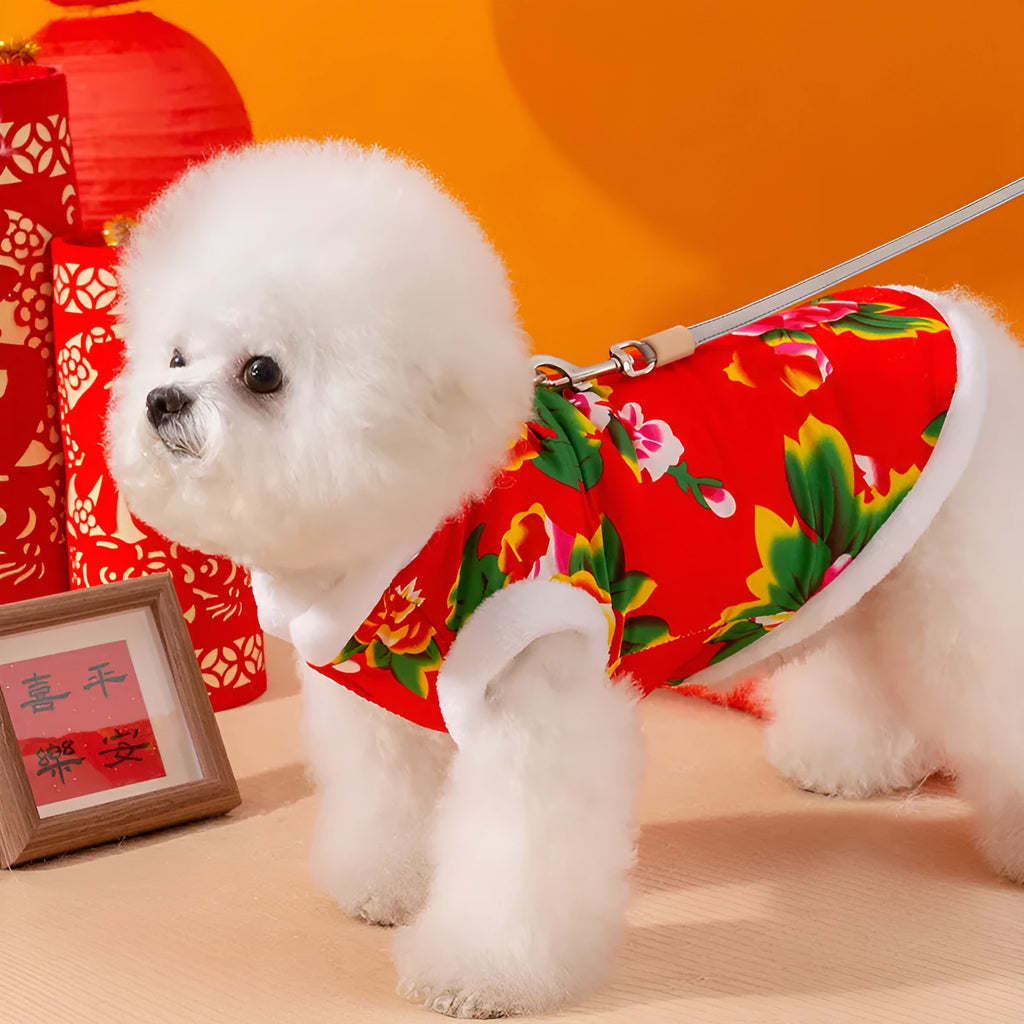 Red winter dog vest with plush lining, metal D-ring, and large floral peony pattern on a small dog