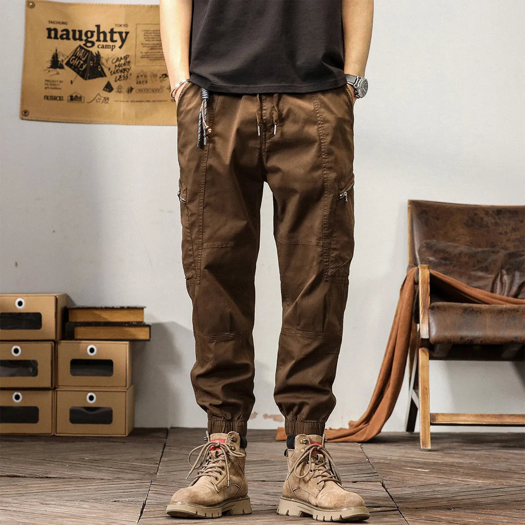 Men's khaki coloured loose fit cotton harem pants with a tapered ankle band.