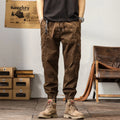 Men's khaki coloured loose fit cotton harem pants with a tapered ankle band.