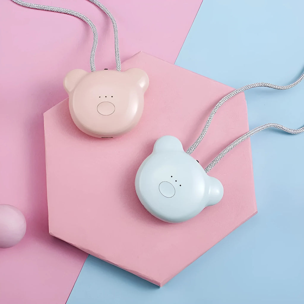 Mini USB air purifier pendant on a necklace, shown in pink colour with charging cable.