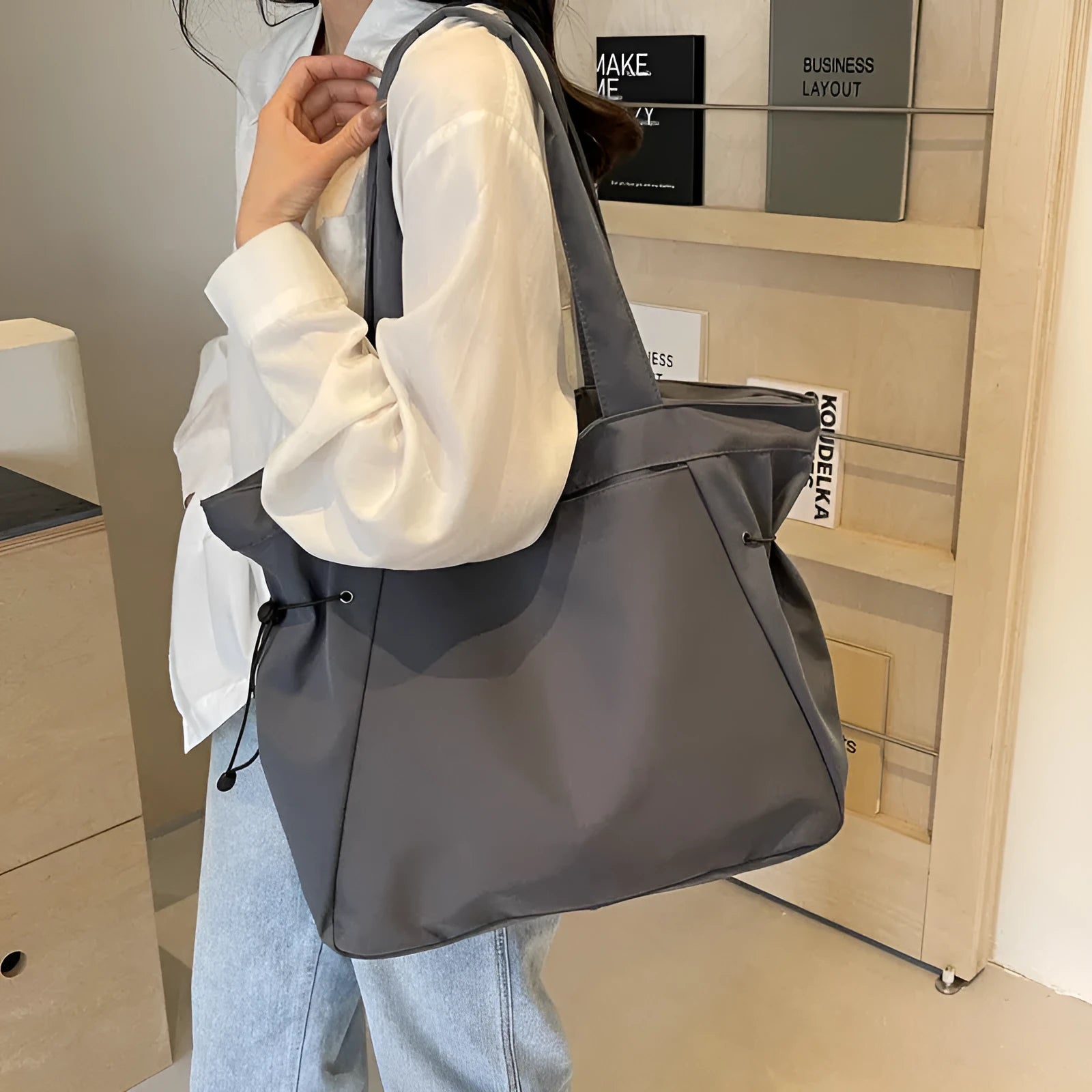 Folding Oxford cloth tote bag in multiple colour options showing compact storage design