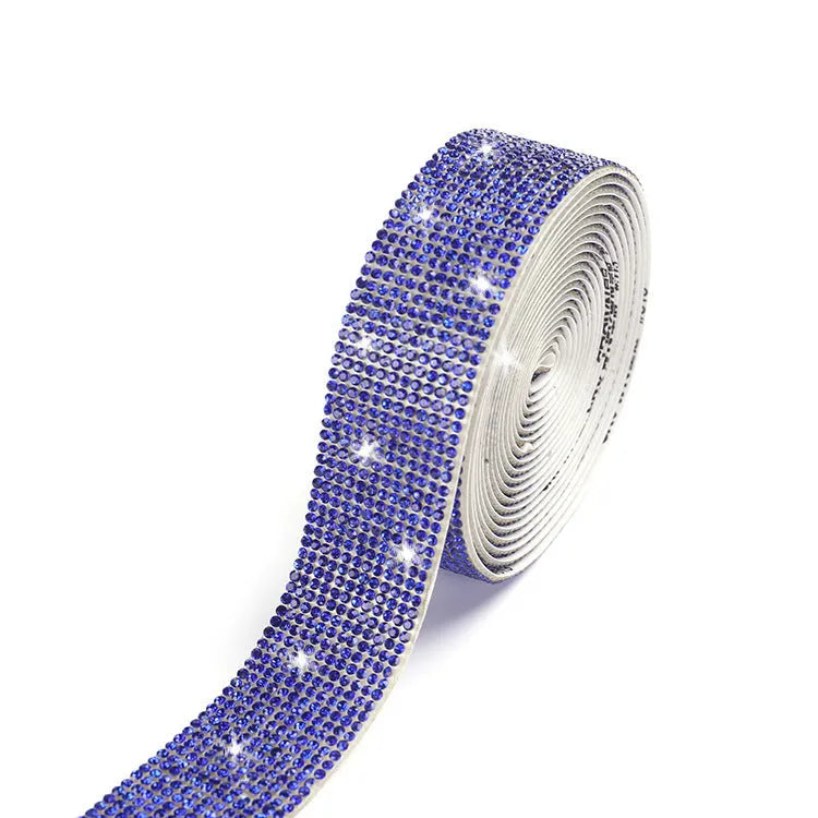 A 1 yard long strip of self-adhesive glass water drills in white and AB colour for clothing decoration