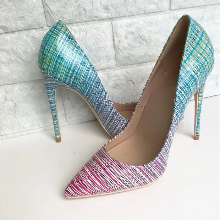 Pink to blue gradient patent leather ladies pointed toe high heels on a plain background