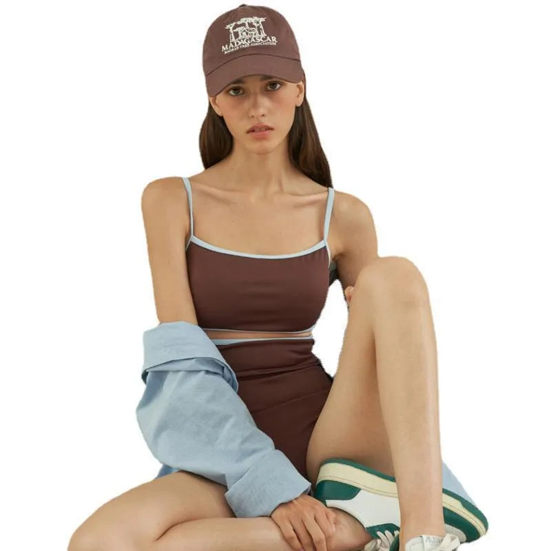 Brown triangle top one-piece swimsuit for women on a hanger.