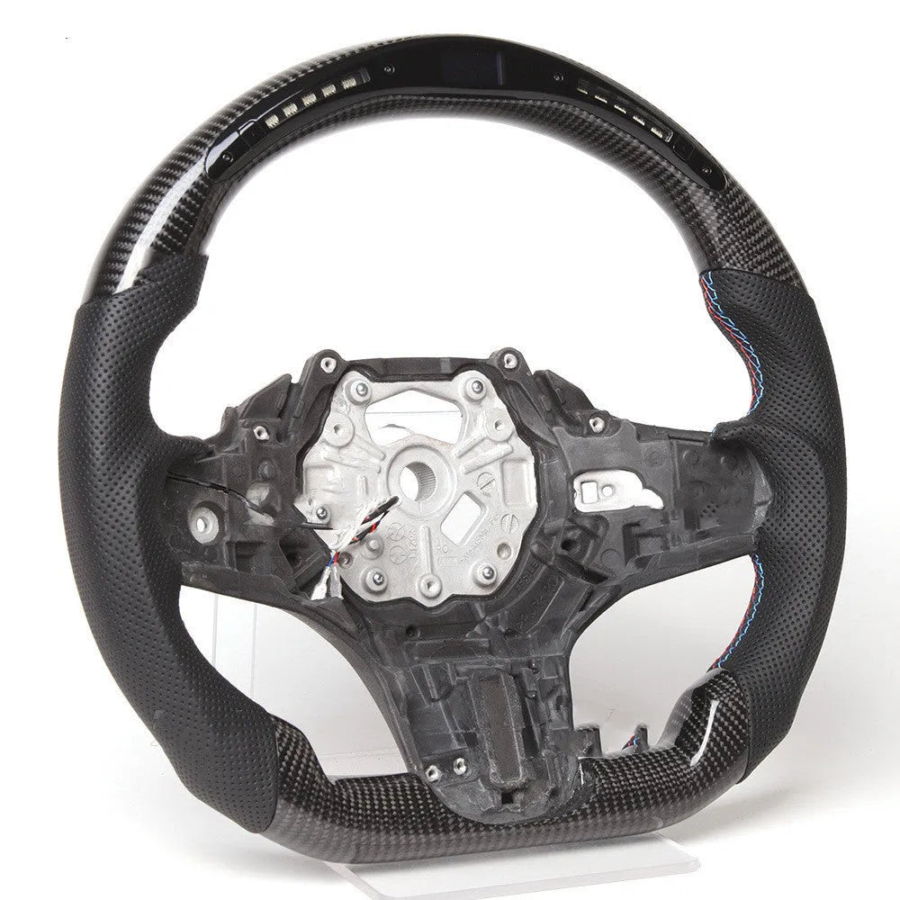 Black carbon fibre sports steering wheel with LED display for BMW X3 and X5 cars.