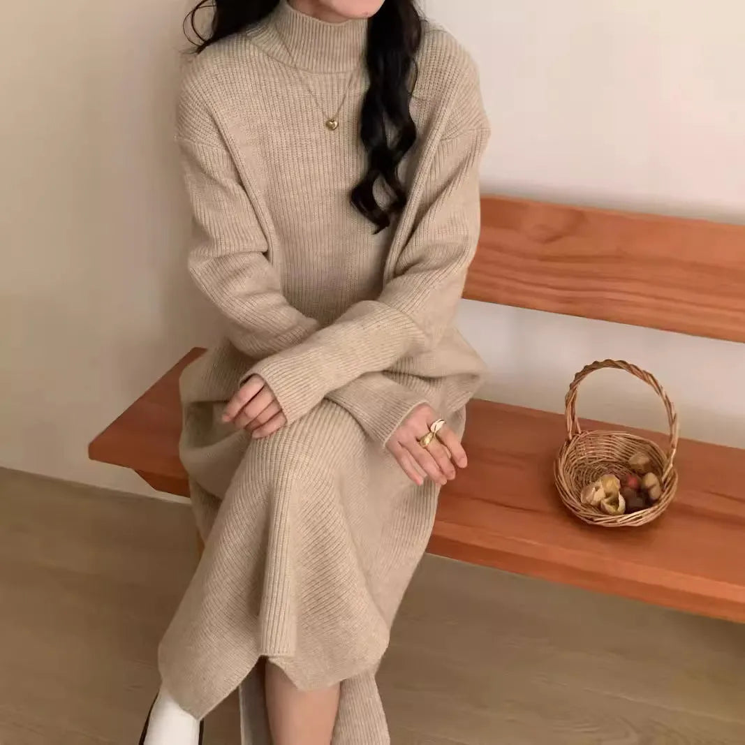Half turtleneck long sleeve knitted dress in a solid colour, shown in a high-waisted midi length.