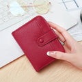 Ladies' short wallet with lychee pattern texture in beige, pink, black, and red colour options