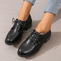 Black women's low-top PU leather shoes with a chunky mid-heel and pointed toe.