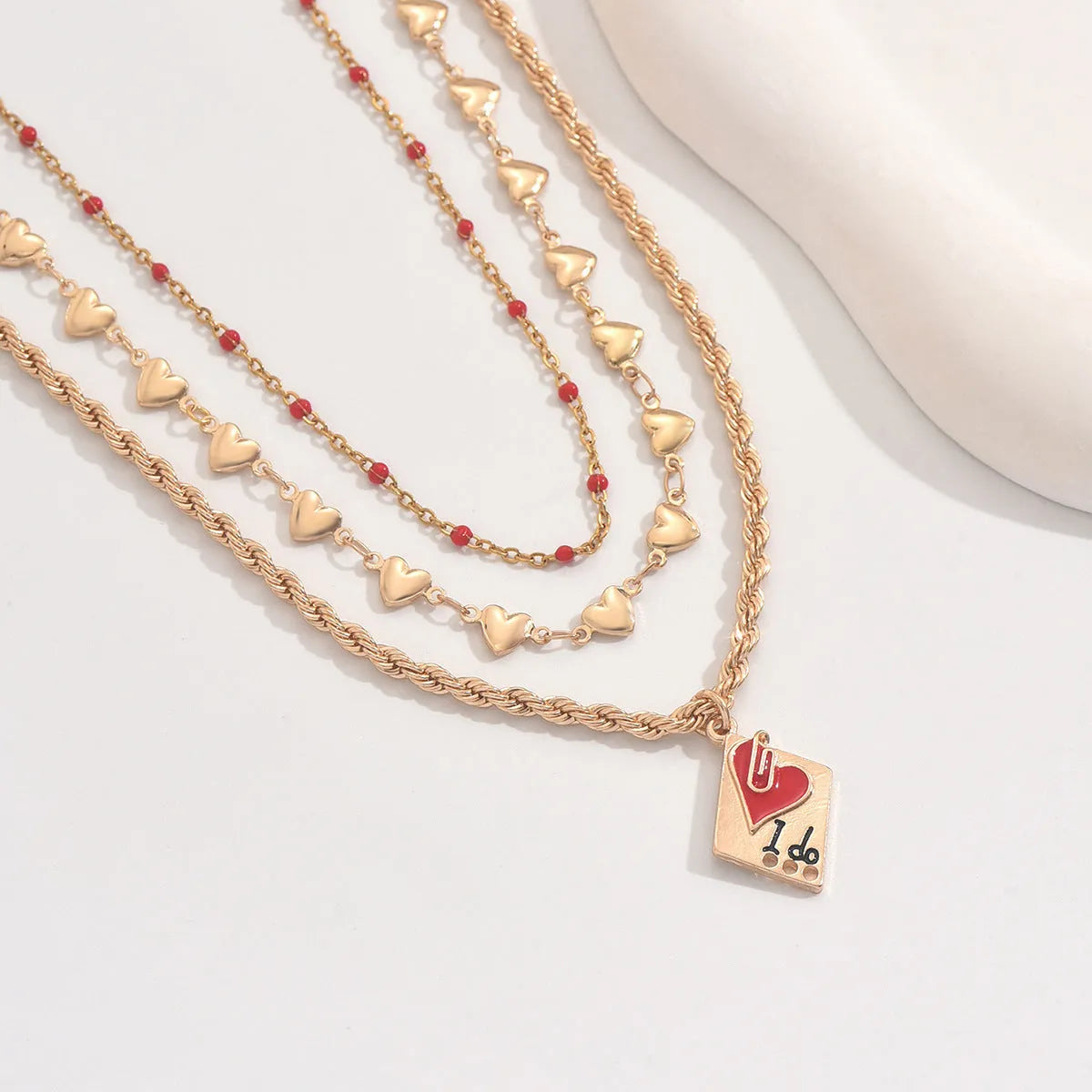 Zinc alloy geometric heart pendant on three-layer adjustable clavicle chain necklace